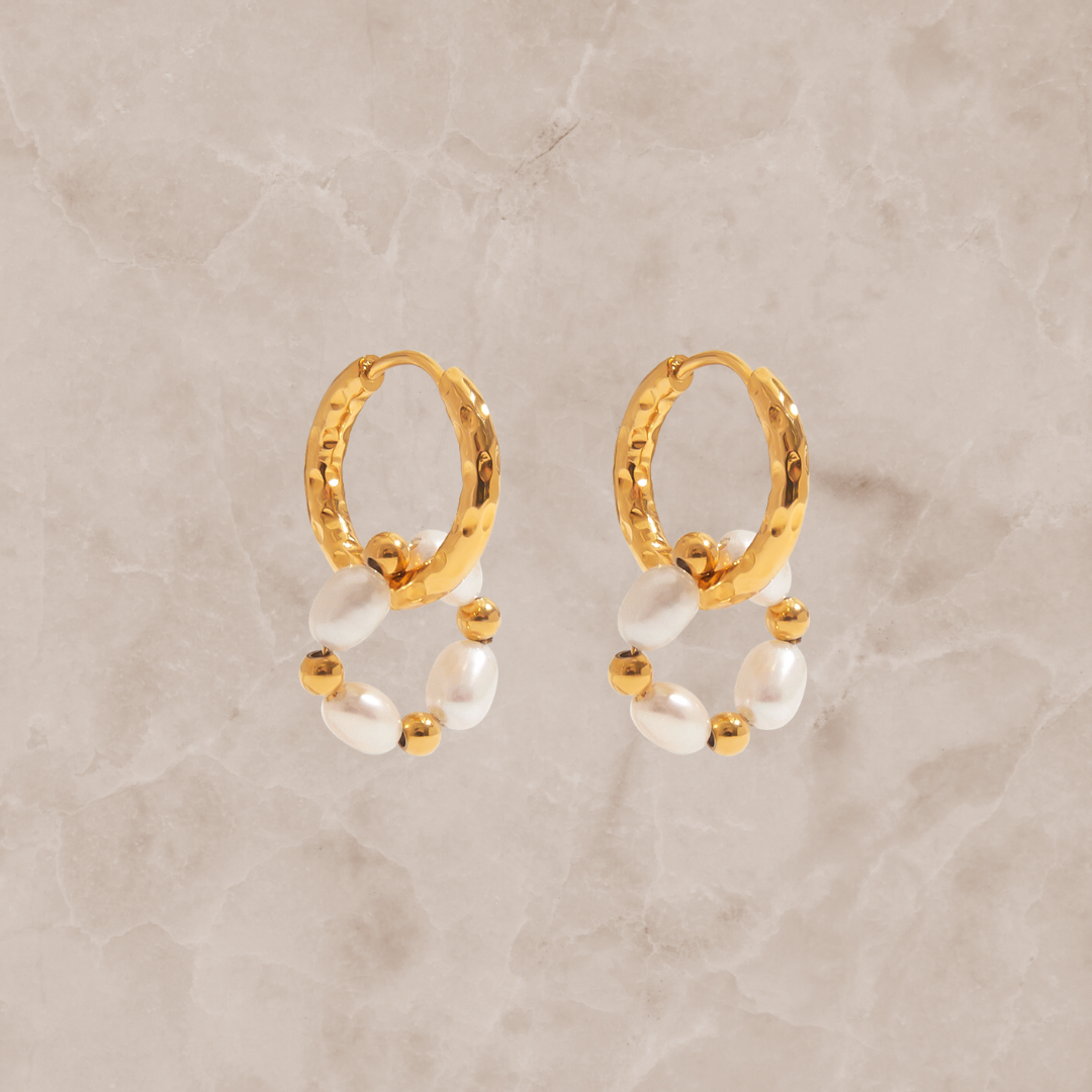 Gold heart and zircon stud earrings by Kataleya