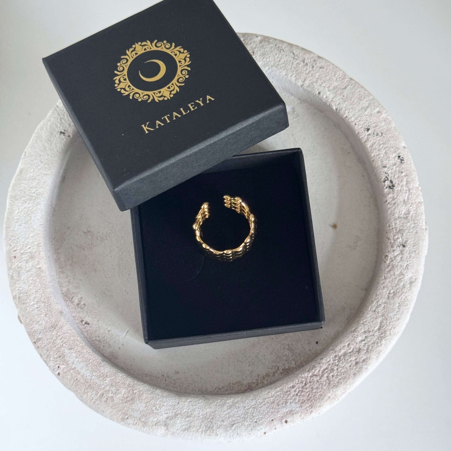 Mesh Open Ring displayed in a Kataleya box, highlighting its modern lattice design and gold finish.