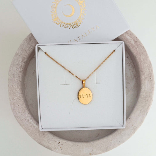 Elegant 1111 Necklace featuring a gold pendant, displayed in a jewelry box on a neutral background.