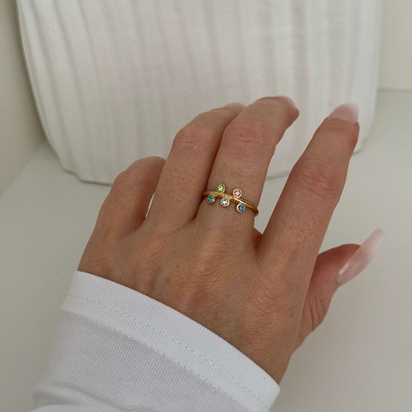 Starlight Sparkle Gold Adjustable Ring adorned with colorful zirconia stones, by Kataleya.