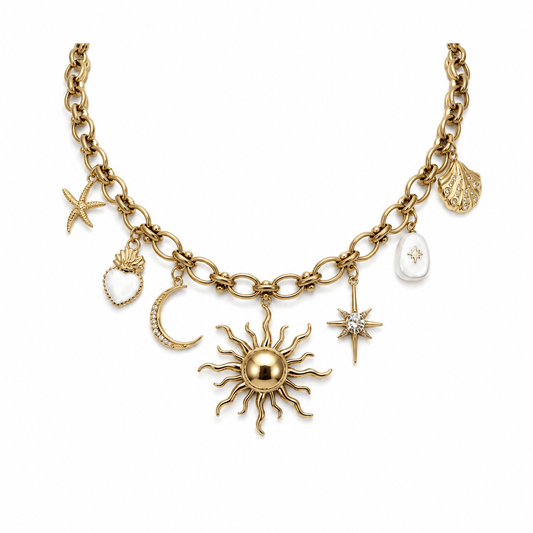 Gold celestial statement charm necklace with sun, moon, star, and shell charms.