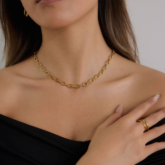 Aurelia waterproof gold chain necklace worn by a model, showcasing its elegance and versatile charm styling.