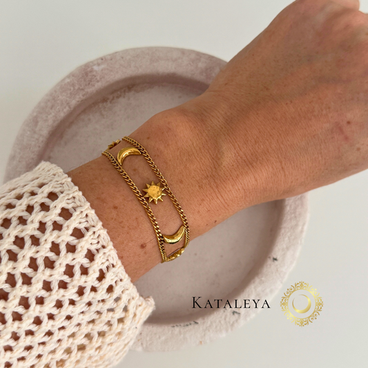 Celestial Harmony Bracelet featuring sun and moon charms on a wrist, waterproof and tarnish free.