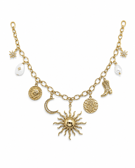 Asteria Charm Necklace showcasing gold celestial charms including sun, moon, and stars, perfect for adding magic to any outfit.