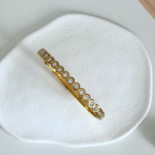 Elyra - Waterproof Gold Zircon Bangle featuring shimmering zircon stones on a sleek gold design