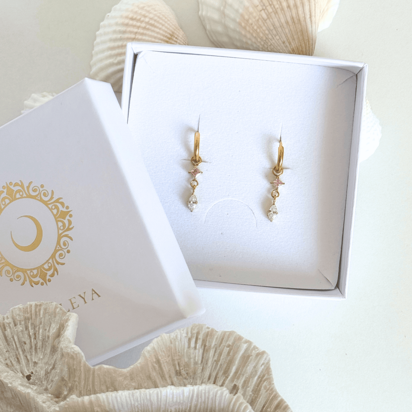Glow Drop Earrings-a graceful blend of delicate gold plated hoops, shimmering pink crystals and marquise-cut cubic zirconia drops, by Kataleya.