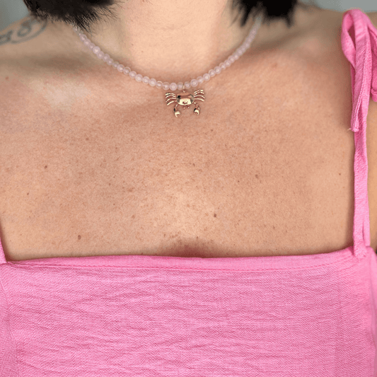 Golden Crab Tide Necklace, pink beaded necklace with a gold crab charm, handmade by Kataleya Jewellery