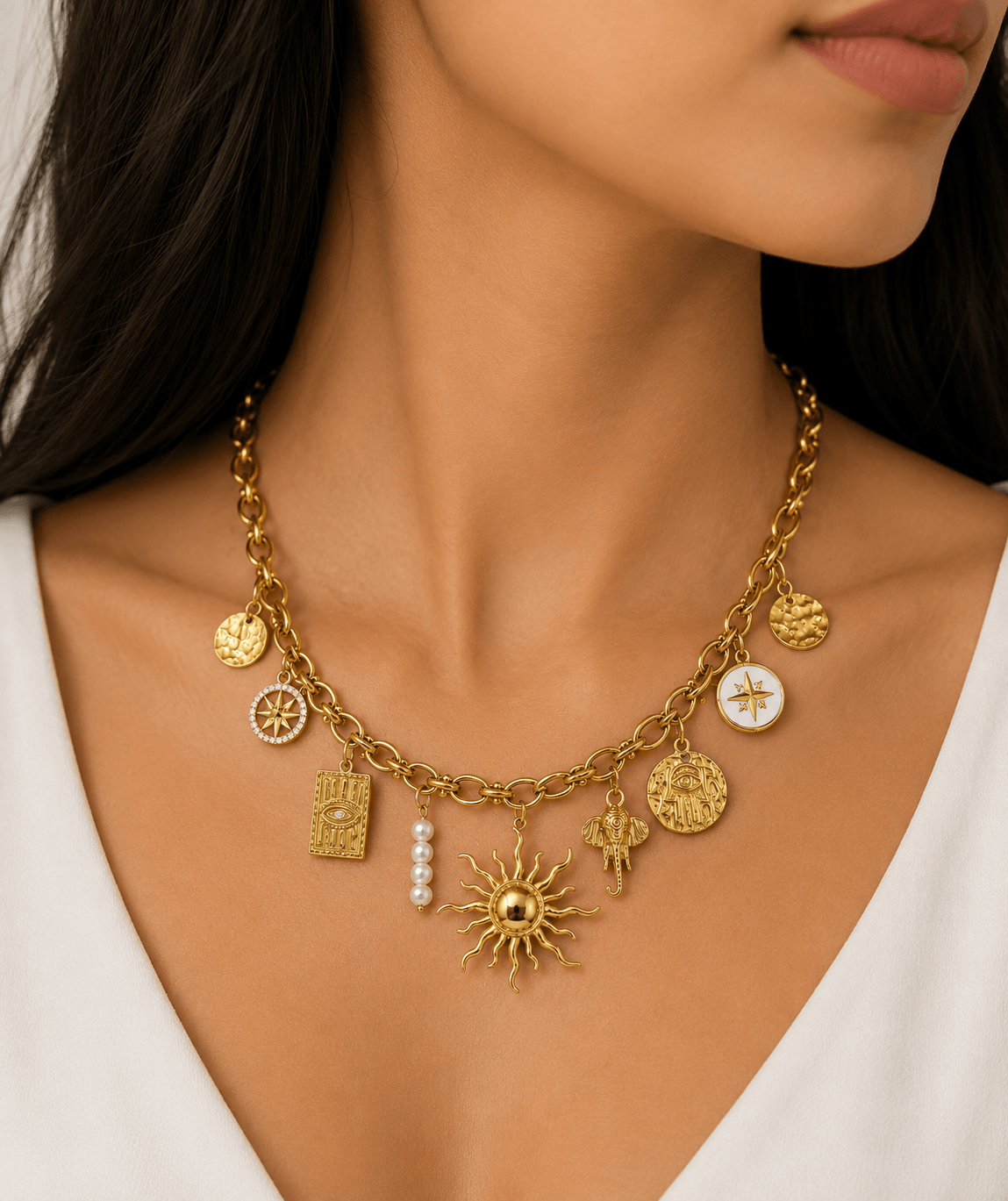 Helia Charm Necklace featuring sun, Hamsa, compass, elephant, and pearls - a stunning charm necklace for intentional jewellery wearers.