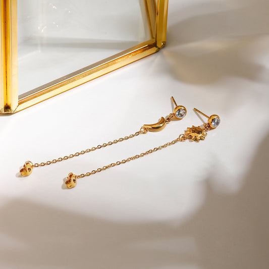 Celestial Harmony Earrings featuring zircon studs with gold sun and crescent moon drops.