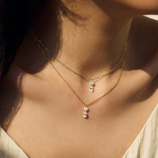 Close-up of a woman wearing a Seraphine Grace delicate necklace with a pendant - Kataleya Jewellery