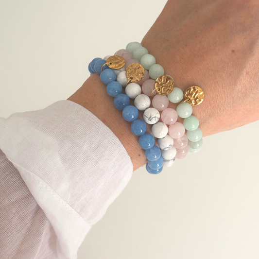 Blue beaded bracelet with gold disk handmade by Kataleya Jewellery