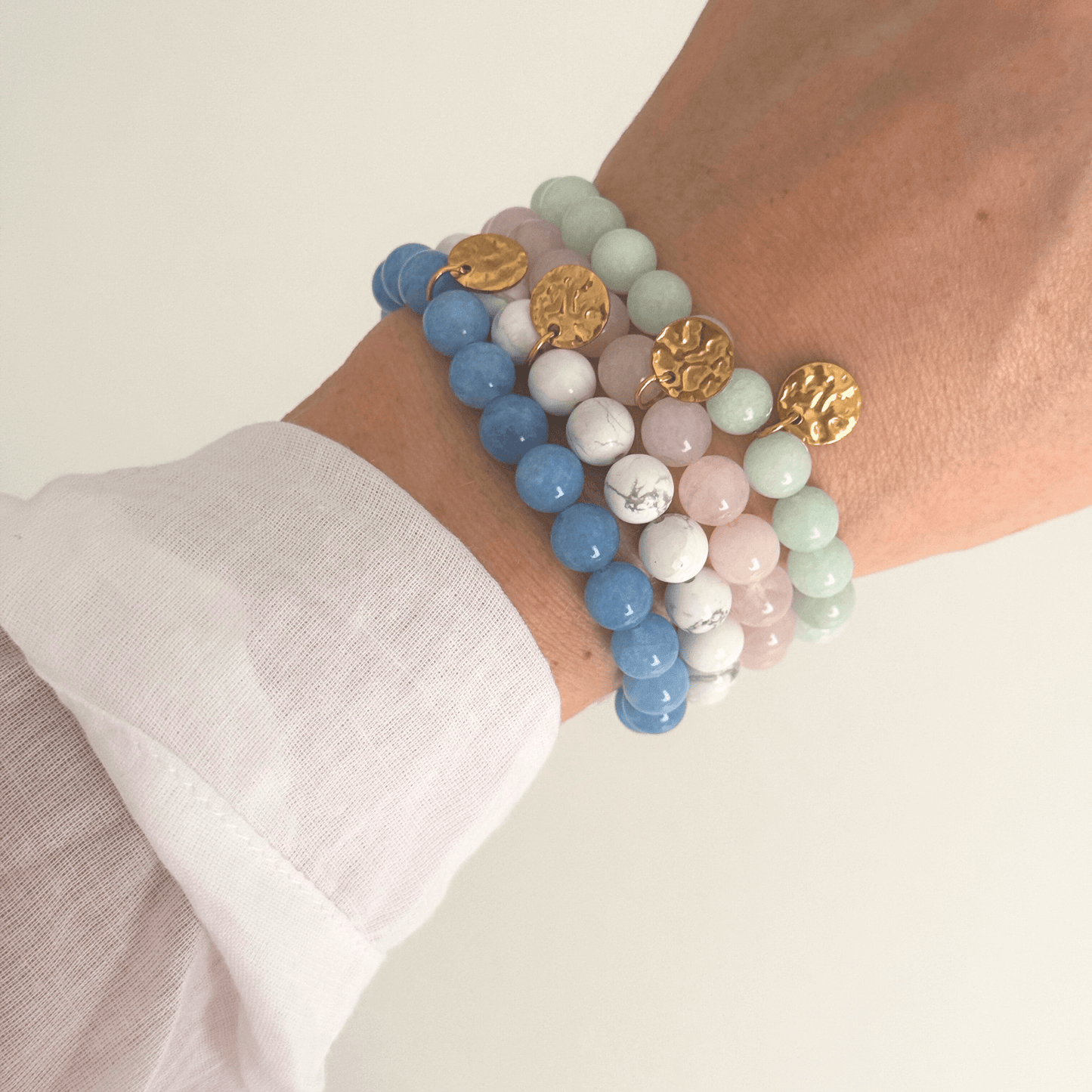 Pink beaded bracelet with golden disk, handmade by Kataleya Jewellery