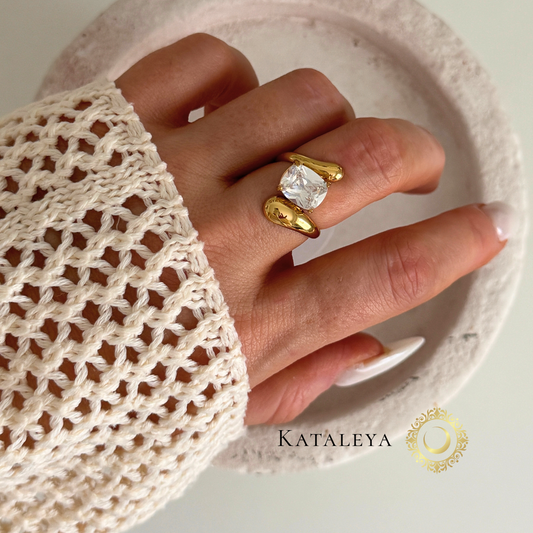 Hand wearing a Twist Diamond Ring with a gold finish, showcasing its elegant design and modern styling.