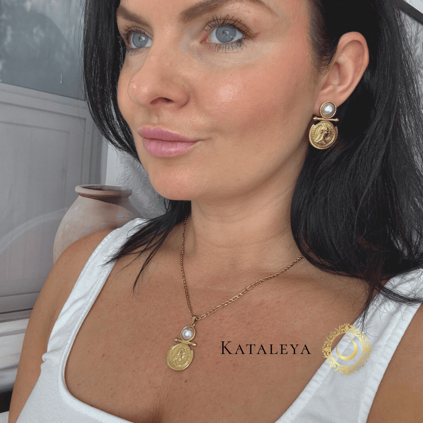 Aura Coin Pearl Necklace worn with matching earrings, showcasing a pearl and Queen Victoria medallion detail.