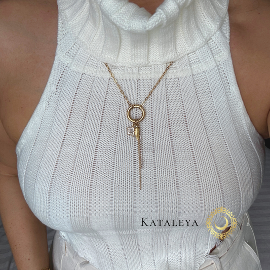 Celestial Long Charm Necklace showcased on a model in a white top, featuring a golden star and feather charm.