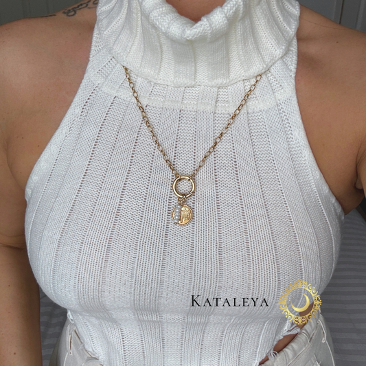 Divine Pearl Long Necklace showcased on a model wearing a stylish white top, highlighting elegance and feminine strength.