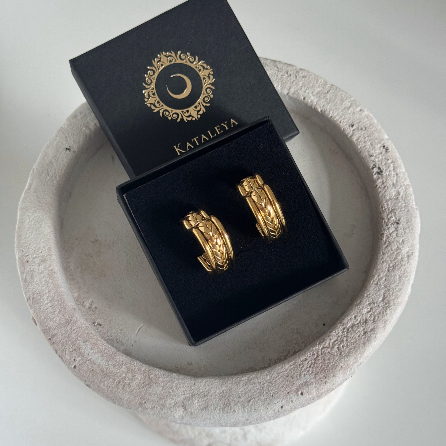 Chunky Gold Heart Earrings displayed in a black gift box with KATALEYA logo on a round stone plate.