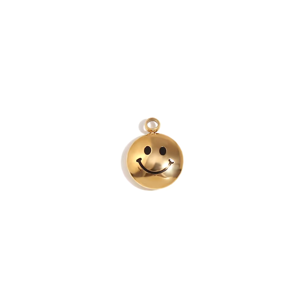 Gold smiley face charm on a white background - Kataleya Jewellery