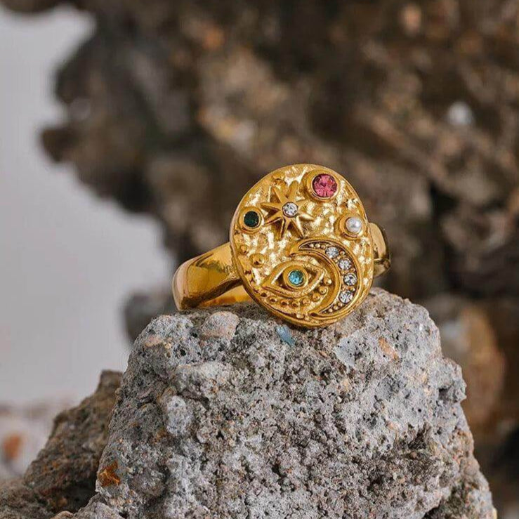 AlUla Gold Hammered Ring adorned with a moon, eye, star, and colorful stones by Kataleya.