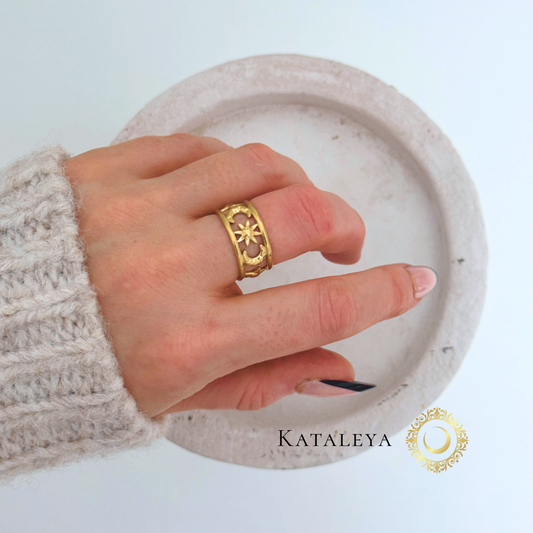 Celestial Harmony Ring showcased on a hand, featuring a gold-plated design against a neutral background.