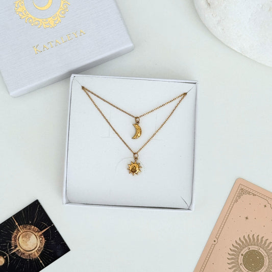 Celestial Harmony Necklace featuring a moon and sun pendant, elegantly displayed in a box, showcasing waterproof jewelry.