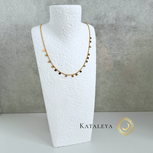 Disc Charm Necklace displayed on a bust showcasing its elegant design with tiny polished discs.
