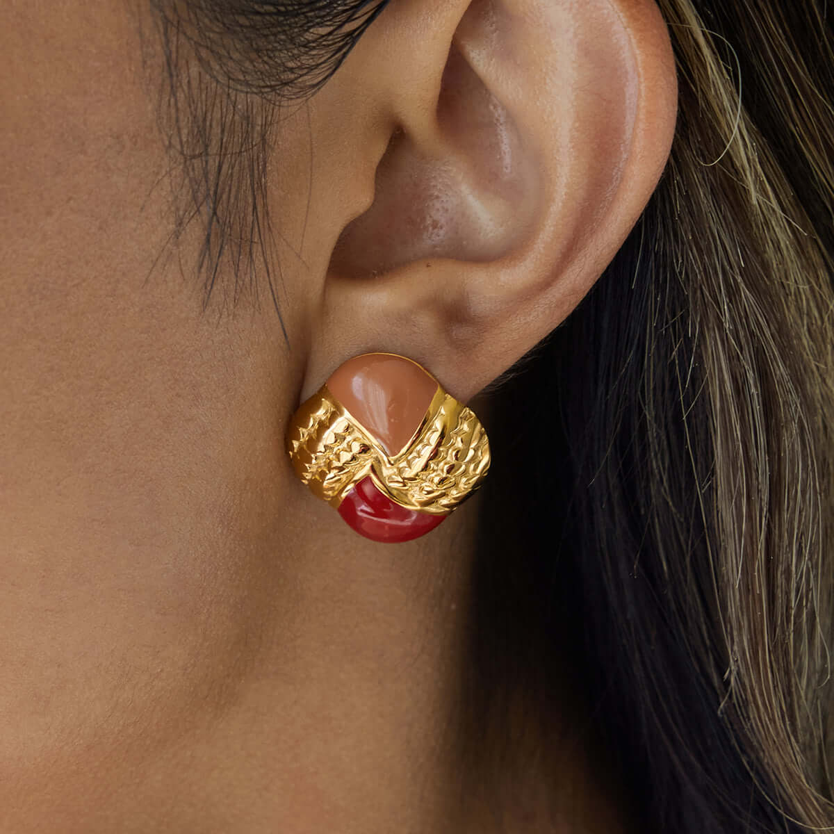 Flame Enamel Earrings worn by model showcasing gold plated stainless steel and vibrant red-orange enamel design.