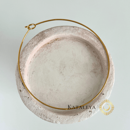 Minimalist Wire Choker displayed on a textured plate, showcasing its sleek and durable design.
