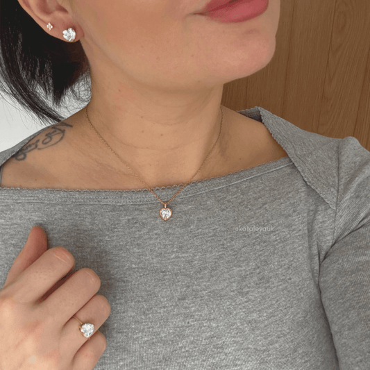 Model wearing Valentina Heart Stud Earrings with Cubic Zirconia along with a matching necklace and ring.