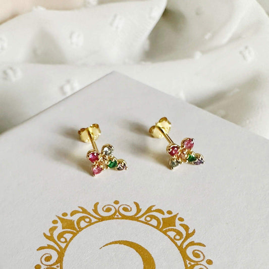 Mini cross stud earrings with colorful zircon stones on a white background.