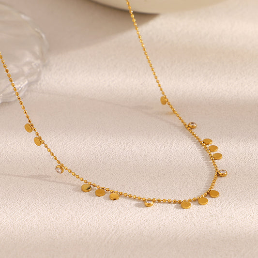 Disc Charm Necklace with delicate gold chain and polished discs, perfect for everyday elegance.