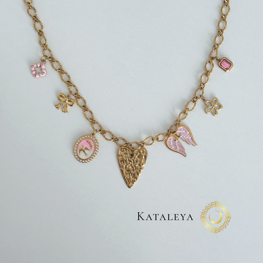 Pink Wings Charm Necklace featuring gold chain and pink charms, including heart, bow, bird, and flower.