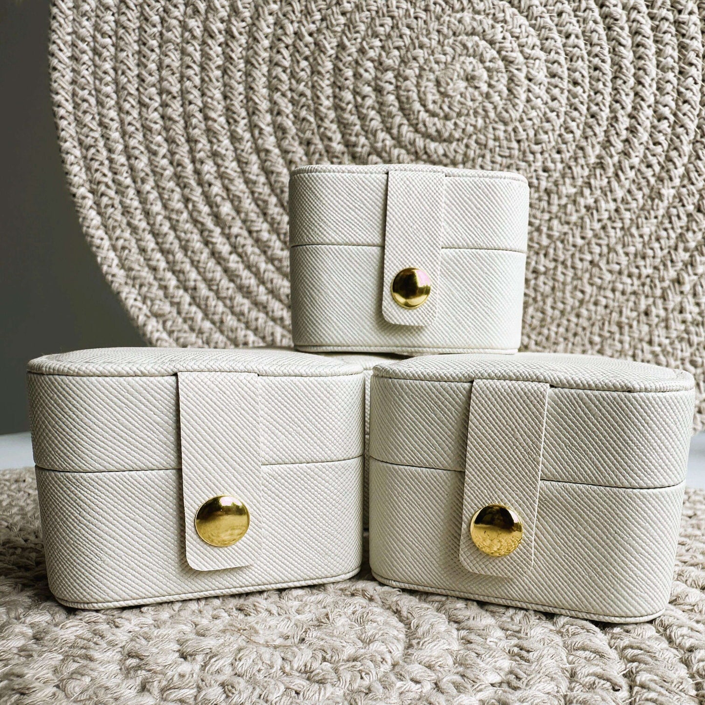Stylish pocket jewellery cases in ecru with gold detailing, perfect for storing and protecting jewellery.