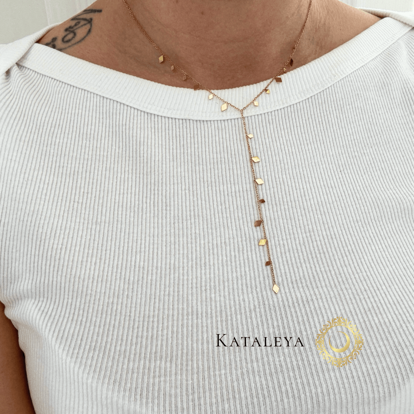 Rhombus Y Necklace worn by a model, showcasing its delicate rhombus-shaped charms and Y-drop silhouette.