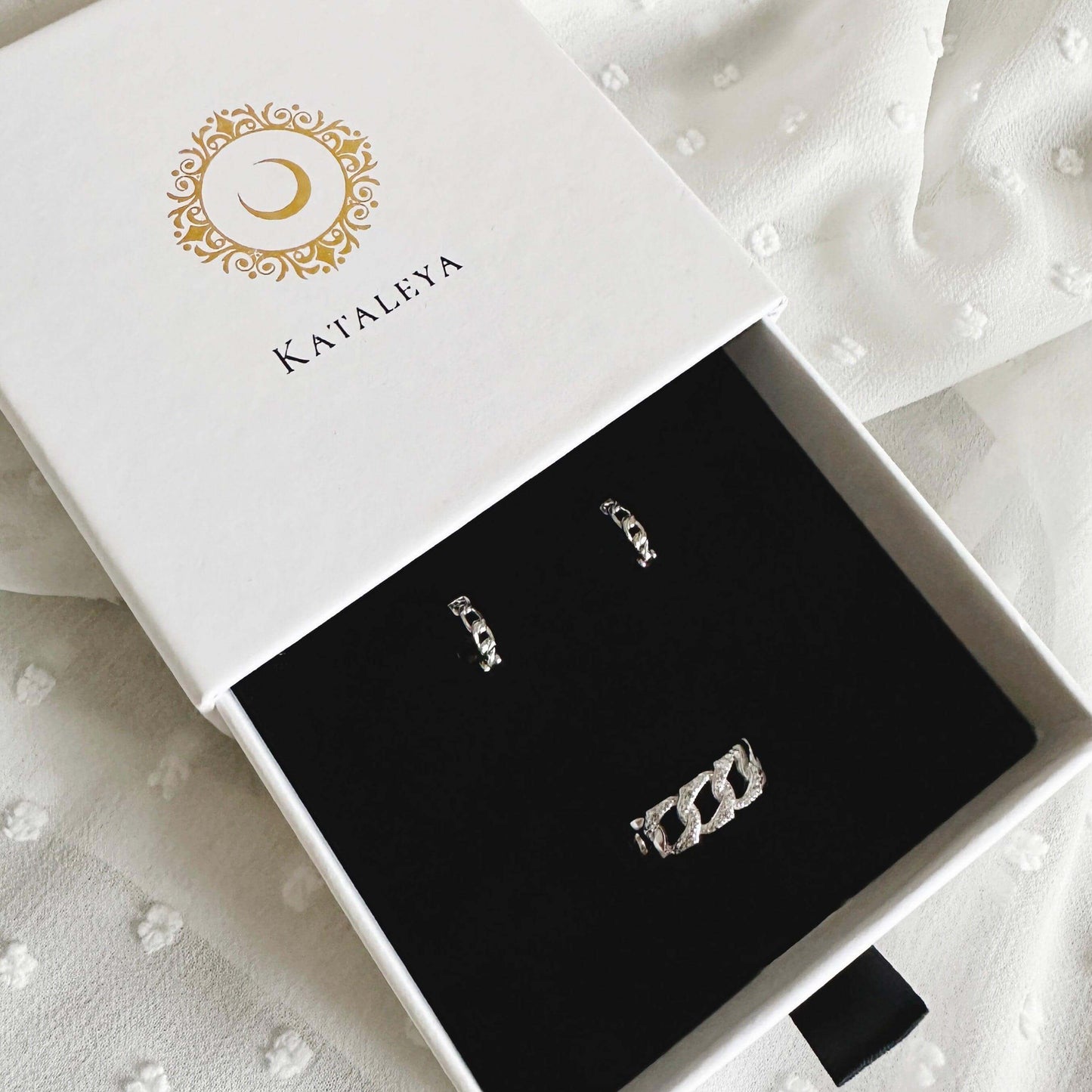 Simone Silver Jewellery Set displayed in a Kataliya box featuring chain huggie hoops and a chain ring.