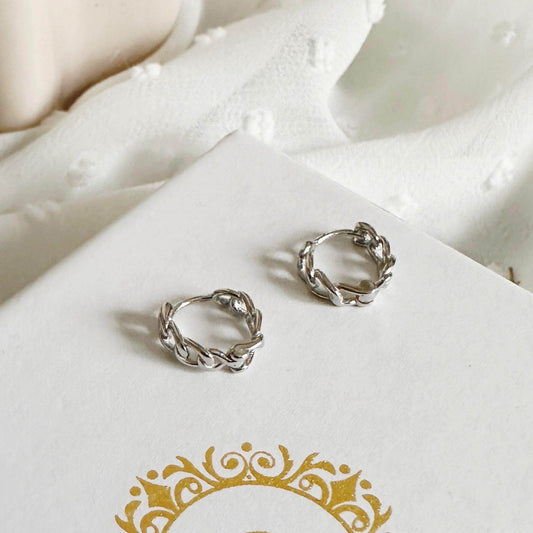Simone Silver Jewellery Set featuring stylish chain huggie hoops on a soft fabric background.