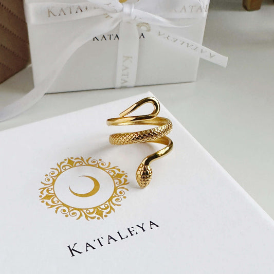 Gold Snake Ring in gold plated stainless steel with intricate design, displayed on a branded gift box.