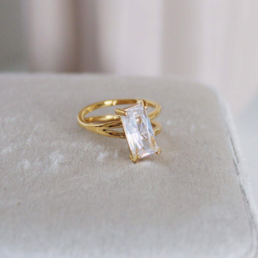 Rectangular diamond ring set in 18ct gold plated stainless steel, showcasing a unique rectangular zircon gemstone.