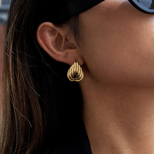 Chunky Teardrop Earrings in gold plating worn by a woman, showcasing a stylish layered teardrop design.