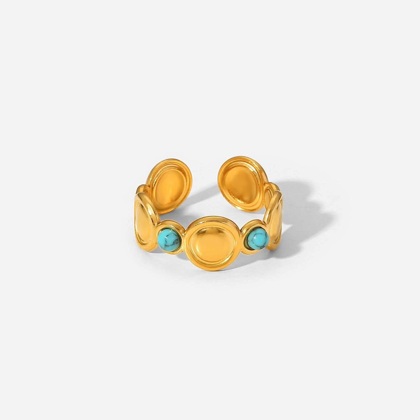Gold Turquoise Adjustable Ring featuring smooth gold-toned discs and vibrant turquoise stones, showcasing Mediterranean charm.
