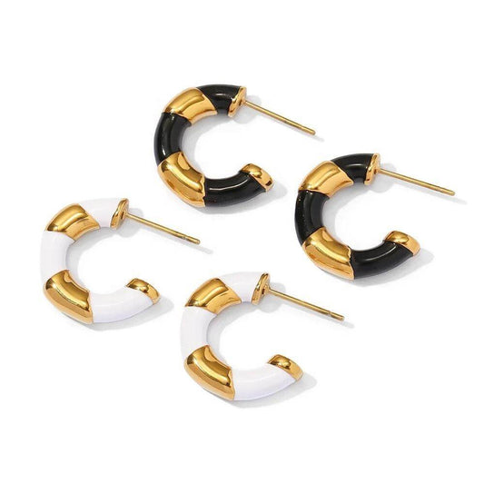 Elegant Stripey CC Earrings in gold plated stainless steel with black and white enamel accents, perfect for any outfit.