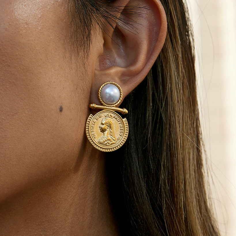 gold coin and pearl earring worn by a woman kataleya jewellery