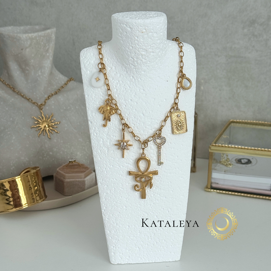 Ankh Goddess Necklace featuring gold and white charms including ankh, elephant, and sparkling key, waterproof and tarnish free.