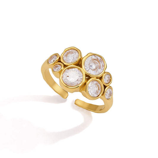 Astra Cluster Ring with eight round cubic zirconia in gold bezel settings, showcasing adjustable open band design.