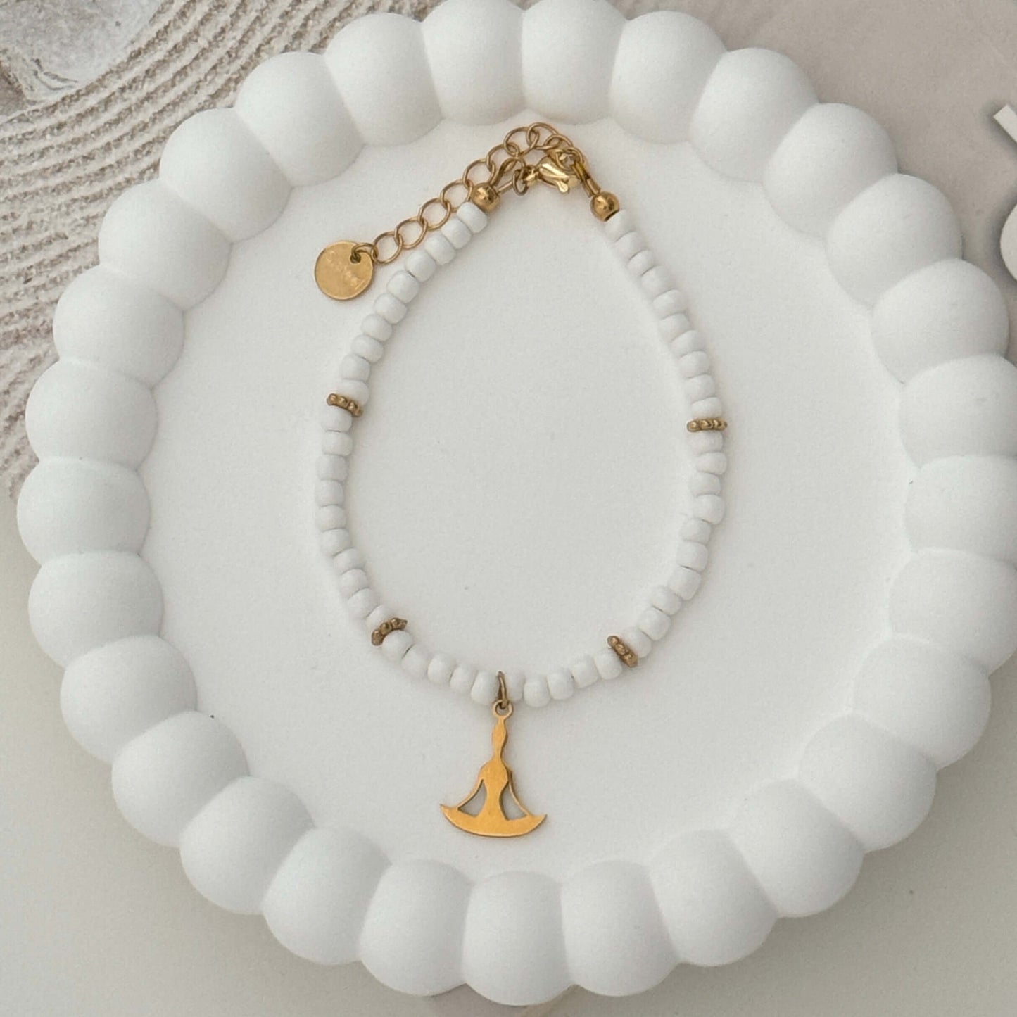 Serene Balance Bracelet - Gold Yoga Pose Pendant on a White and Gold Beaded String by Kataleya