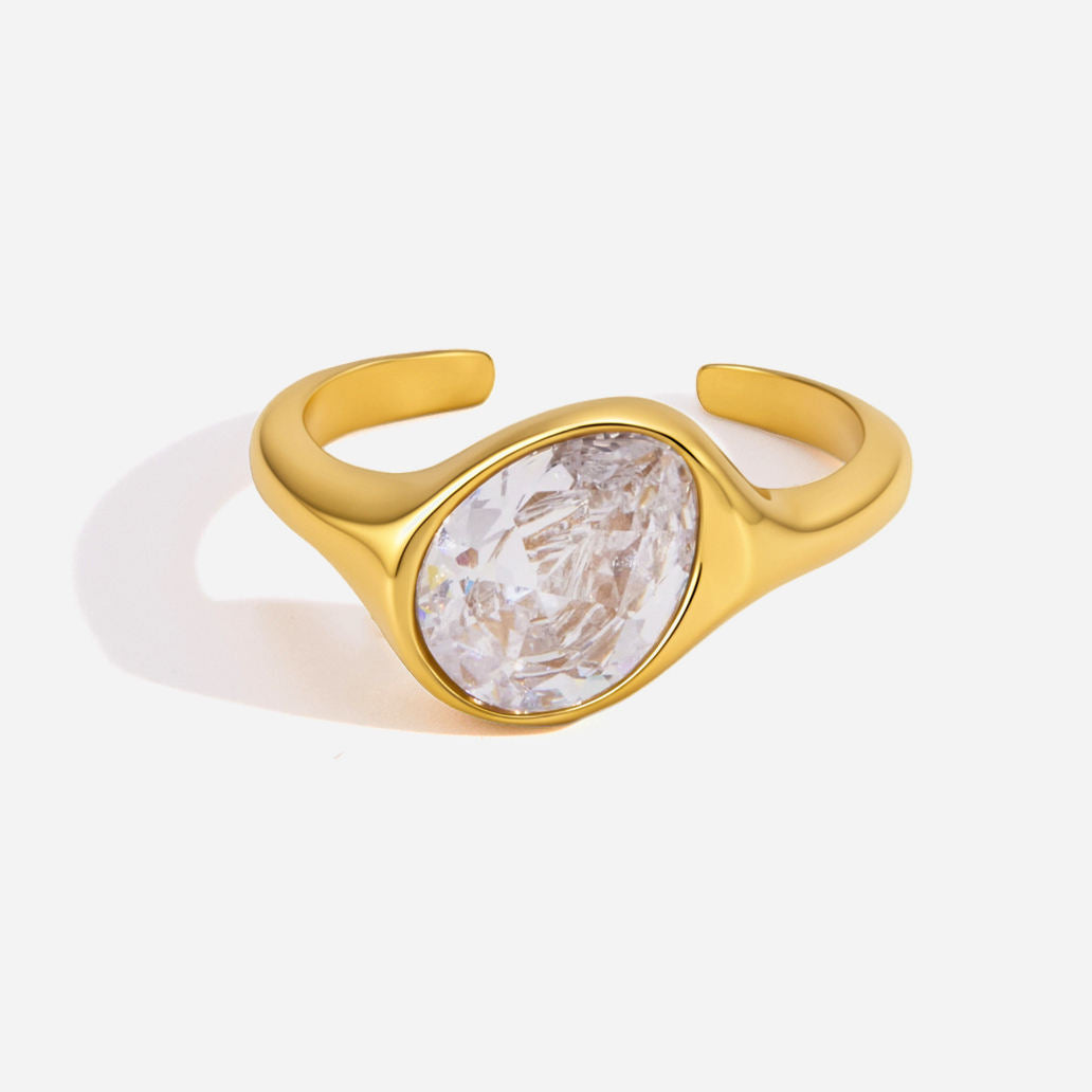 Elara Pinky Ring featuring an oval cubic zirconia set in gold, adjustable band design for comfort.