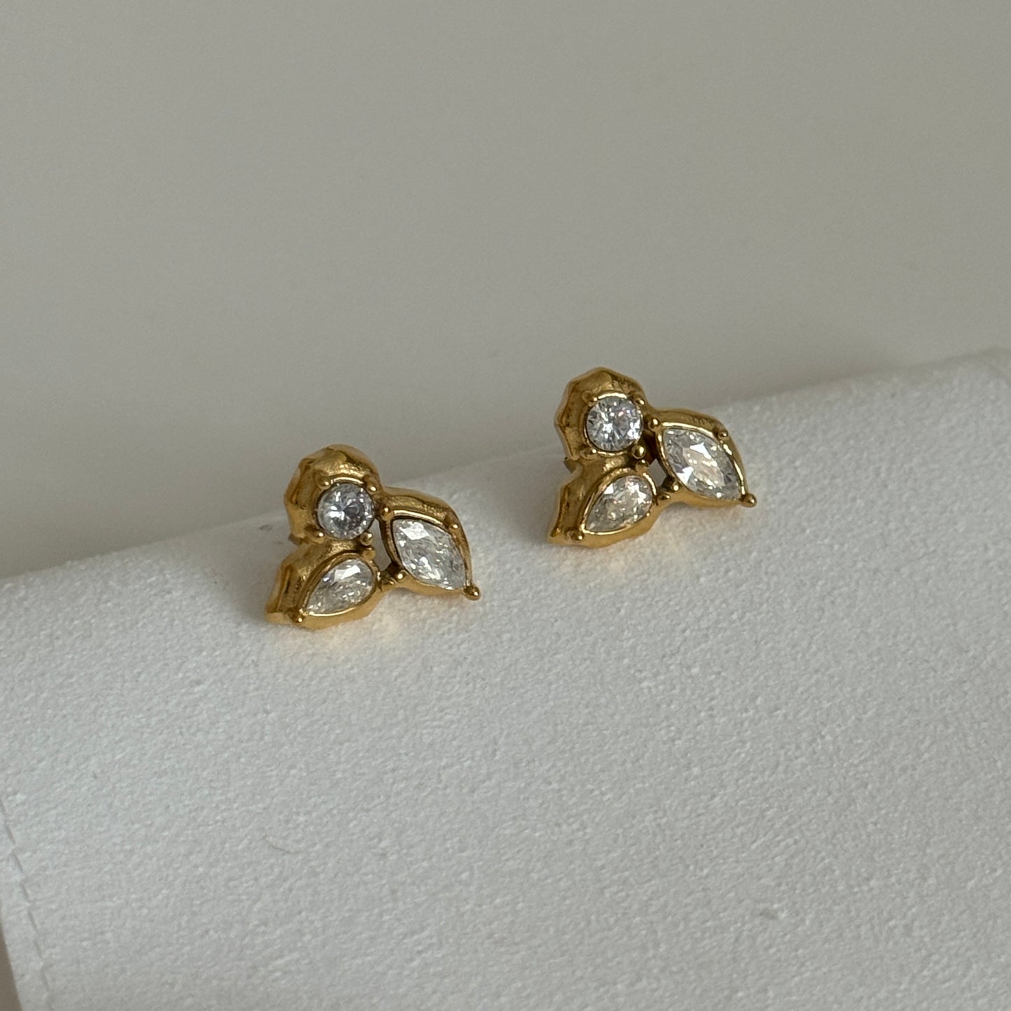 Irregular 3 Leaf Zircon Stud Earrings in Gold by Kataleya