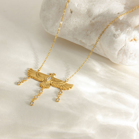 Nekhbet Wing waterproof gold eagle necklace featuring detailed eagle design with sparkling stones.