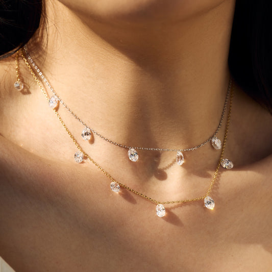 Close-up of a person wearing a Seraphine Radiance - delicate gold necklace with small crystals - Kataleya Jewellery