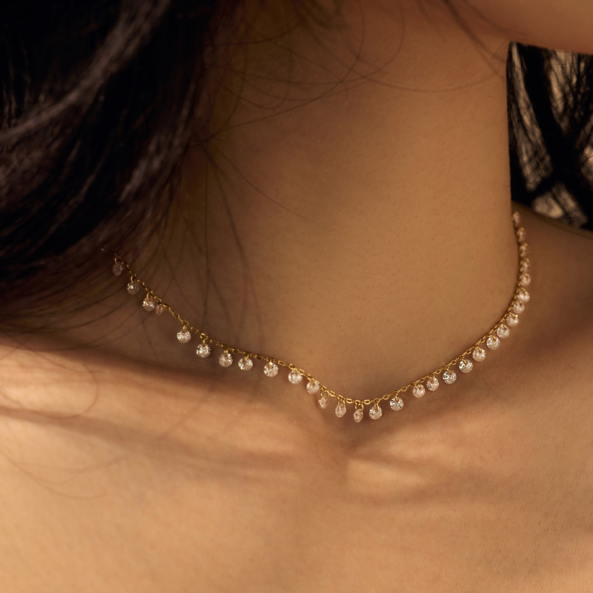 Seraphine Aurora necklace on a person's neck with a neutral background by Kataleya Jewellery